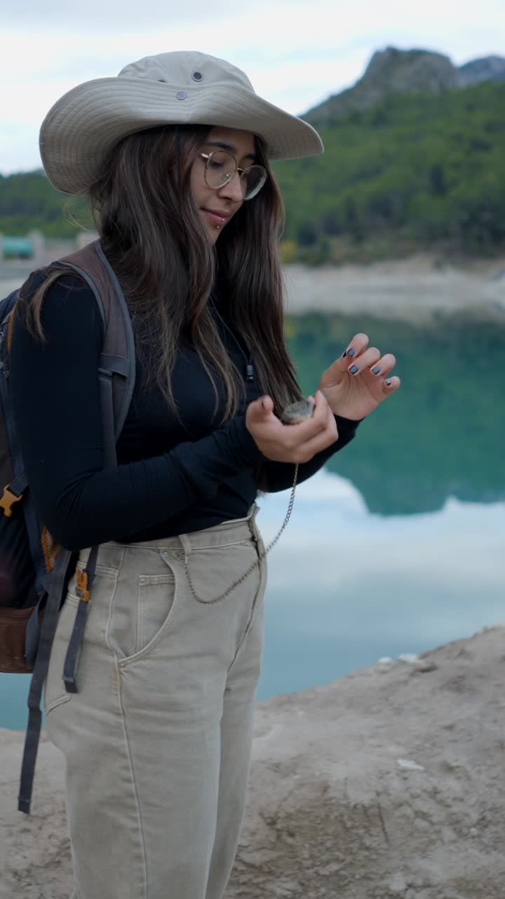 Woman Hiking and Exploring by a Scenic Lake