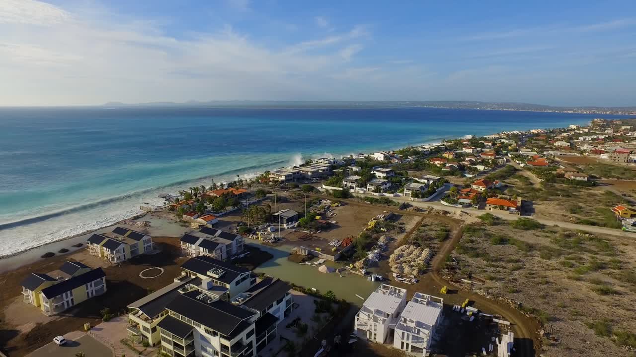 Aerial view of coastal houses and beach