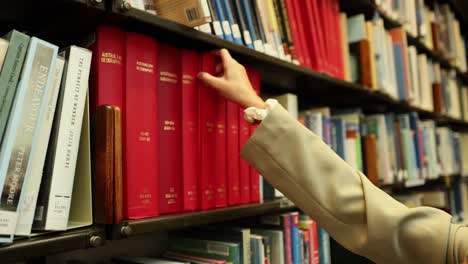 hand reaching for a red book