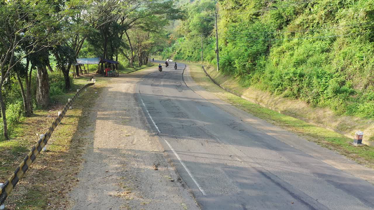 Country Road through Forest with Motorbike