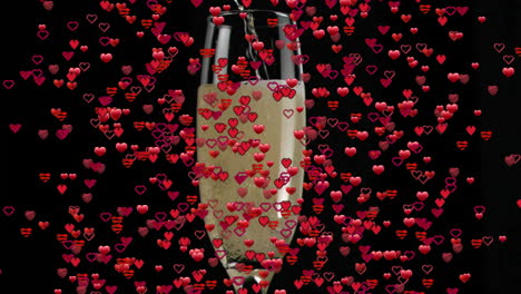 champagne glass with bubbles floating over falling red hearts animation