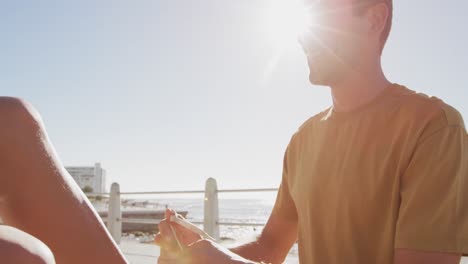 young adult couple relaxing at the seaside