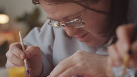 man painting closeup