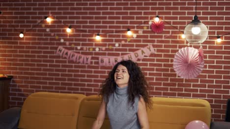 happy young female celebrates birthday holiday party, playing with balloon