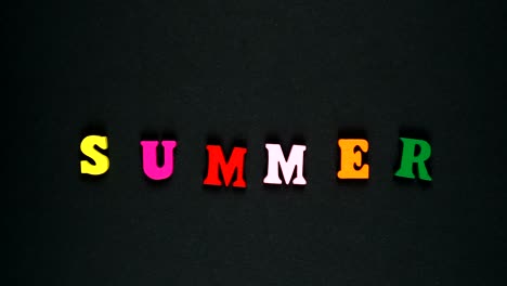 word summer formed of wooden multicolored letters. colorful words loop. stop motion animation