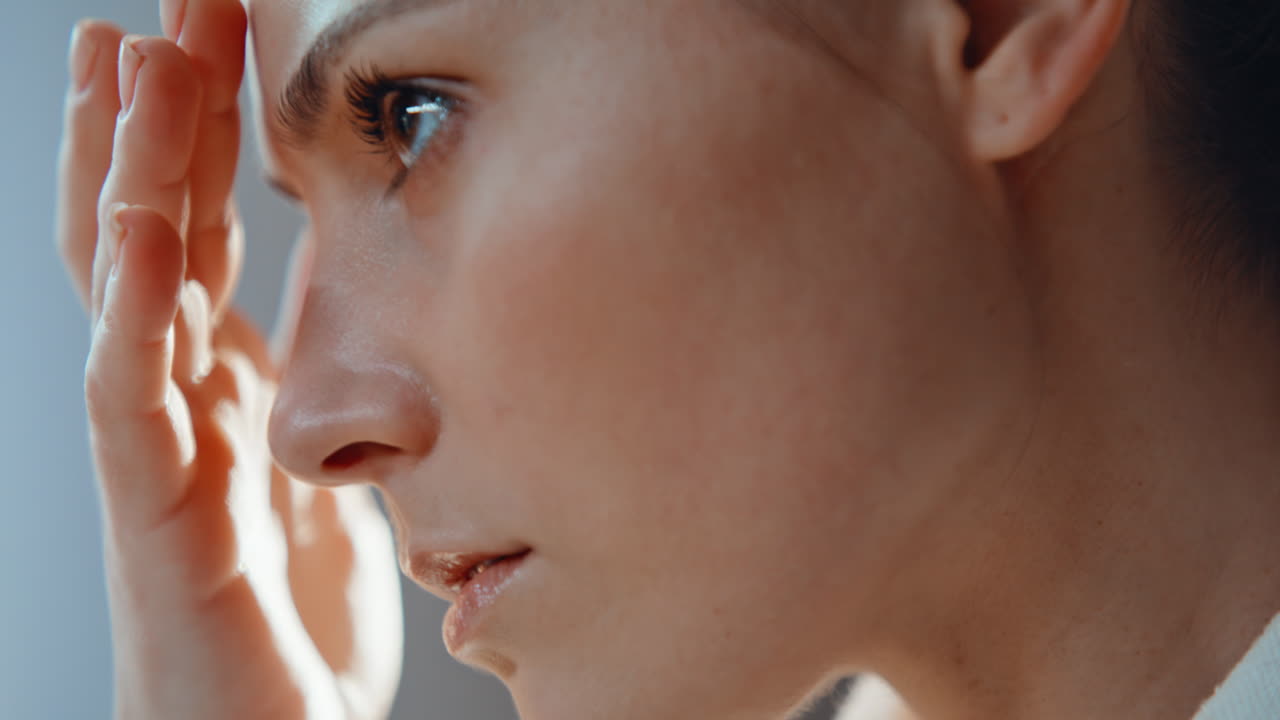 Closeup girl touching facial smooth skin at morning skincare routine closeup