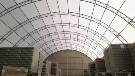 fly-in-warehouse-storing-jar-view-on-ceiling-steel-structure-roof