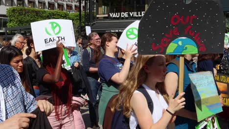 climate change protest: people march for environmental protection