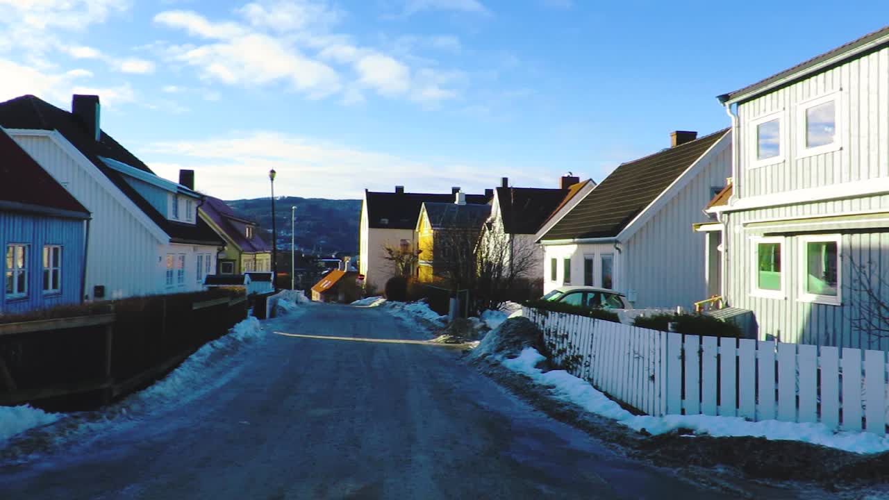 Neighborhood houses on a calm little street in winter in the northern city Trondheim Norway