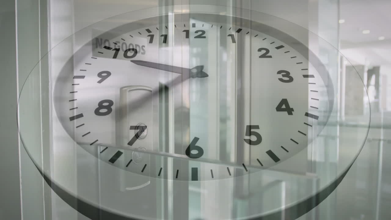 Showing 10:10, clock animation over modern office building interior