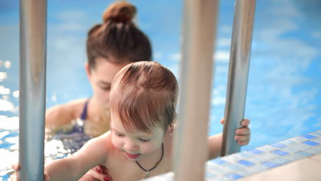 The-cute-baby-getting-out-from-the-swimming-pool