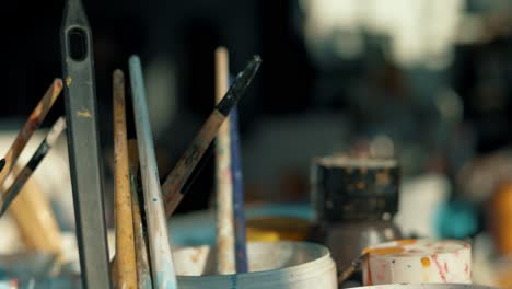 paintbrushes soaked in water to be ready to use