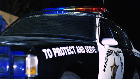 Close-Up-Of-The-Police-Car-From-The-Side-At-Night-1