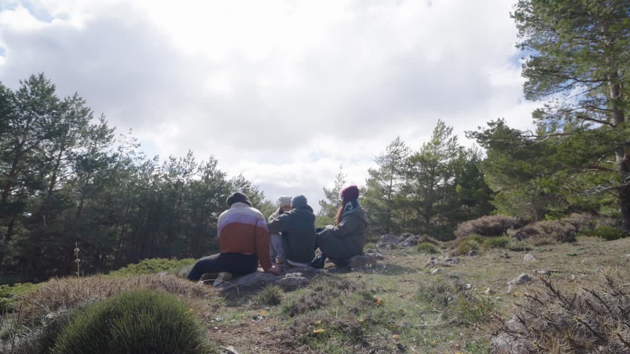 Friends enjoying nature on a hill