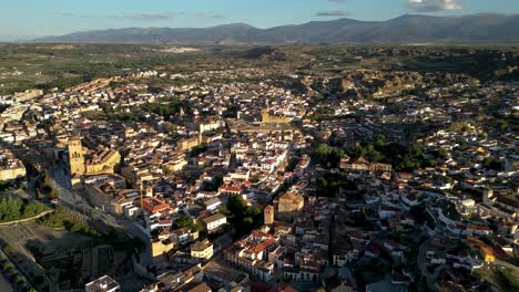 cinematic aerial drone view of city center of guadix