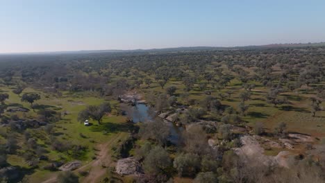 river and rangeland in dehesa, spain