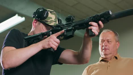 a man learns how to shoot a rifle at the shooting range