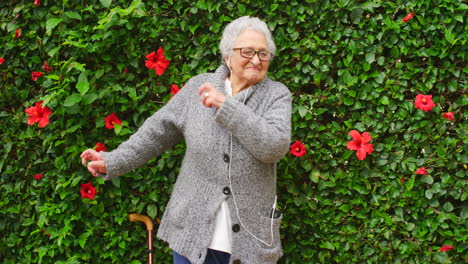 dancing, music and elderly woman in a garden