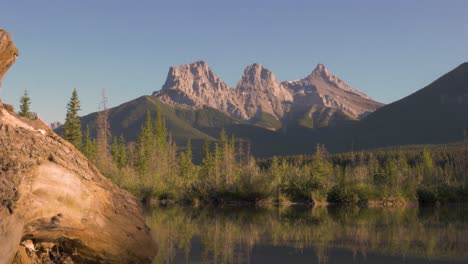 A-Upwards-Pan-Of-The-Three-Sisters-Landmark-Near-Canmore-Alberta