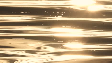 abstract pattern of golden sun reflecting on ocean water waves