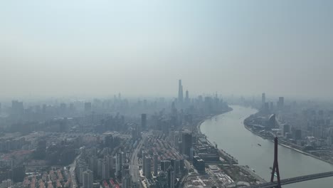 huangpu river and industry area with lujiazui downtown in background