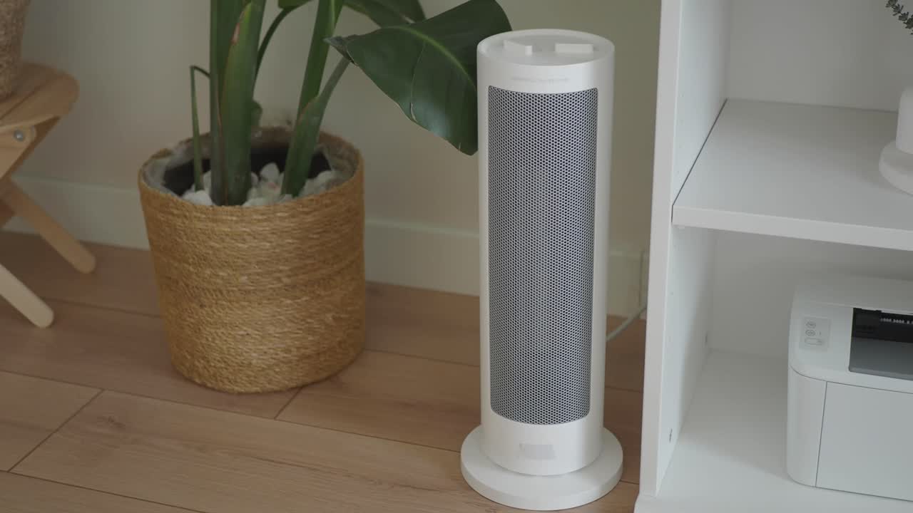Modern White Electric Heater Oscillating in a Home Interior