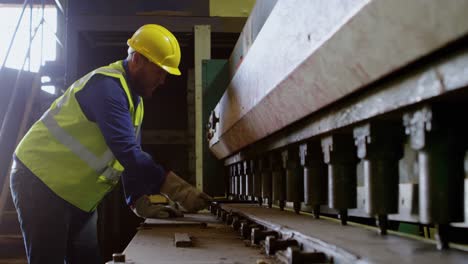 male worker working on machine in warehouse 4k