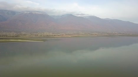 Drone-shot-over-a-lake-in-Greece-during-golden-hour