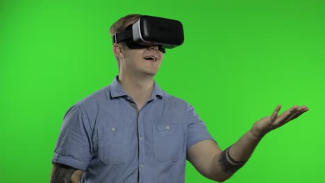 man using vr headset helmet to play game. watching virtual reality 3d 360 video. chroma key