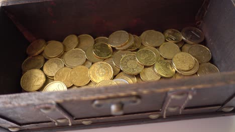 old chest in rotation with coins