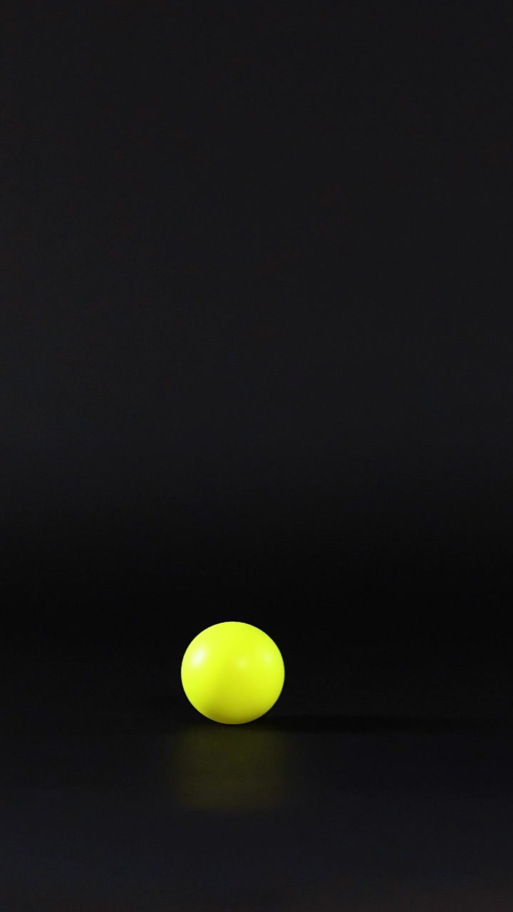 A ping pong ball rolls across a surface