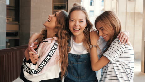 three friends laughing outdoors