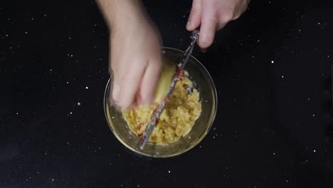 topdown view of grating an apple into a bowl while baking