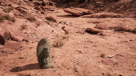 ancient statue on the rocks desert