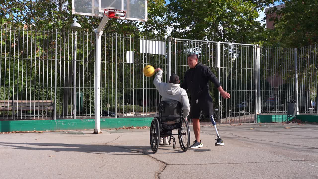 Two Men with Disabilities Playing Basketball on an Outdoor Court