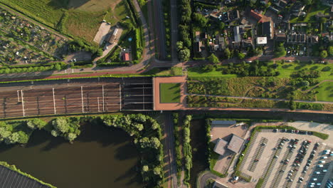 aerial view of barendrecht railway station on sunny day in barendrecht, netherlands. topdown shot