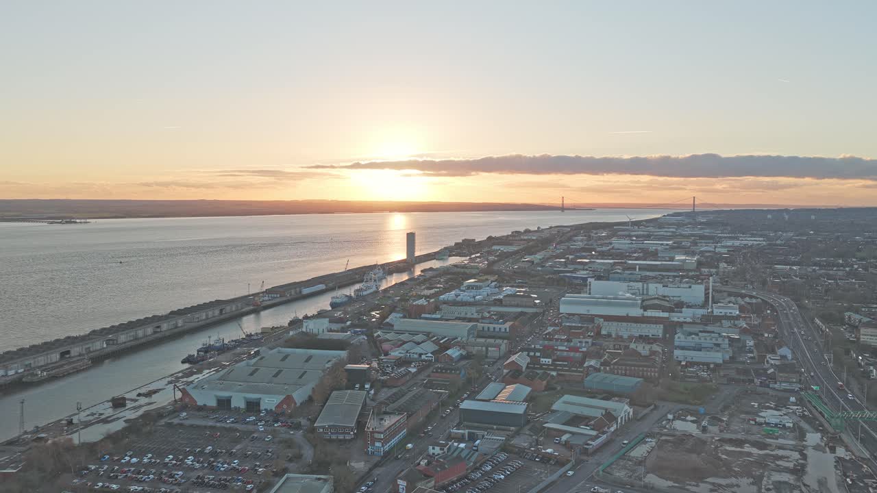 High aerial panoramic view along the Humber estuary and Hull docklands at sunset, Kingston upon Hull, East Riding of Yorkshire, England