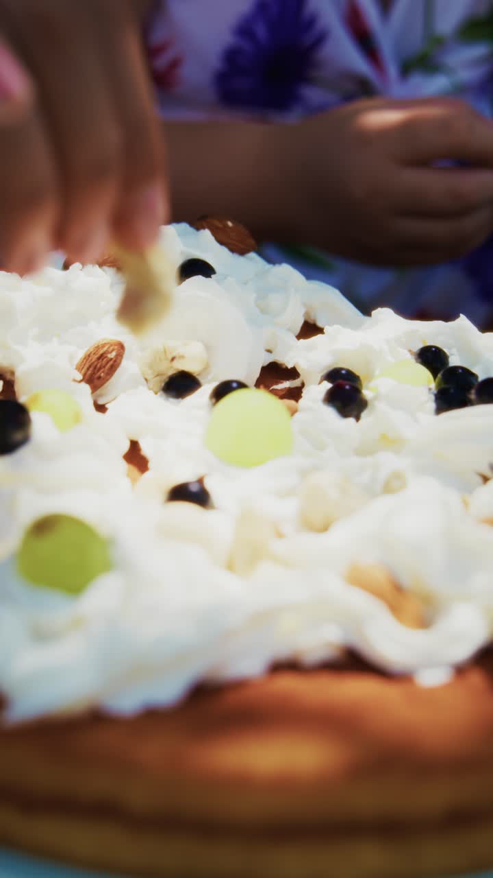 Delightful Cream-Topped Cake with Fresh Fruits and Nuts, Perfect for Celebrations and Sweet Indulgences, Showcasing a Beautiful Dessert in Close-Up