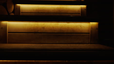 wooden stairs with warm lighting