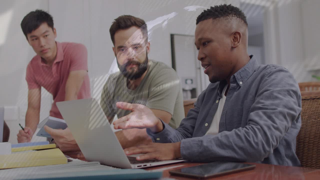 Male speaker gesturing and using laptop in business, causing light overlays, team reviewing content