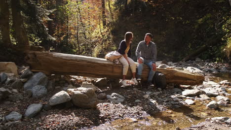 couple hiking in autumn forest