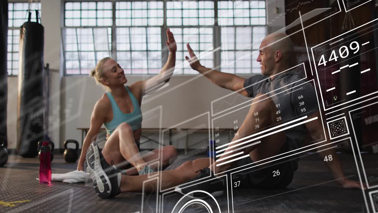Fit duo resting on mat after workout, HUD panels sliding over them while man gesturing high-fiving