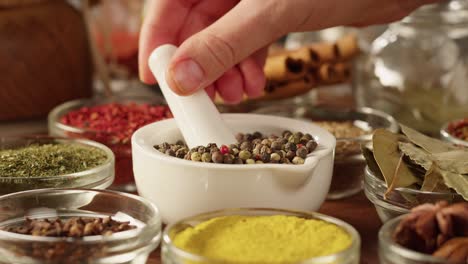 colourful spices in glass bowls close-up. middle eastern and arabian culture. seasoning and flavors. pepper, coriander, cinnamon, turmeric, paprika, cumin. different kinds of dry herbs for cooking.