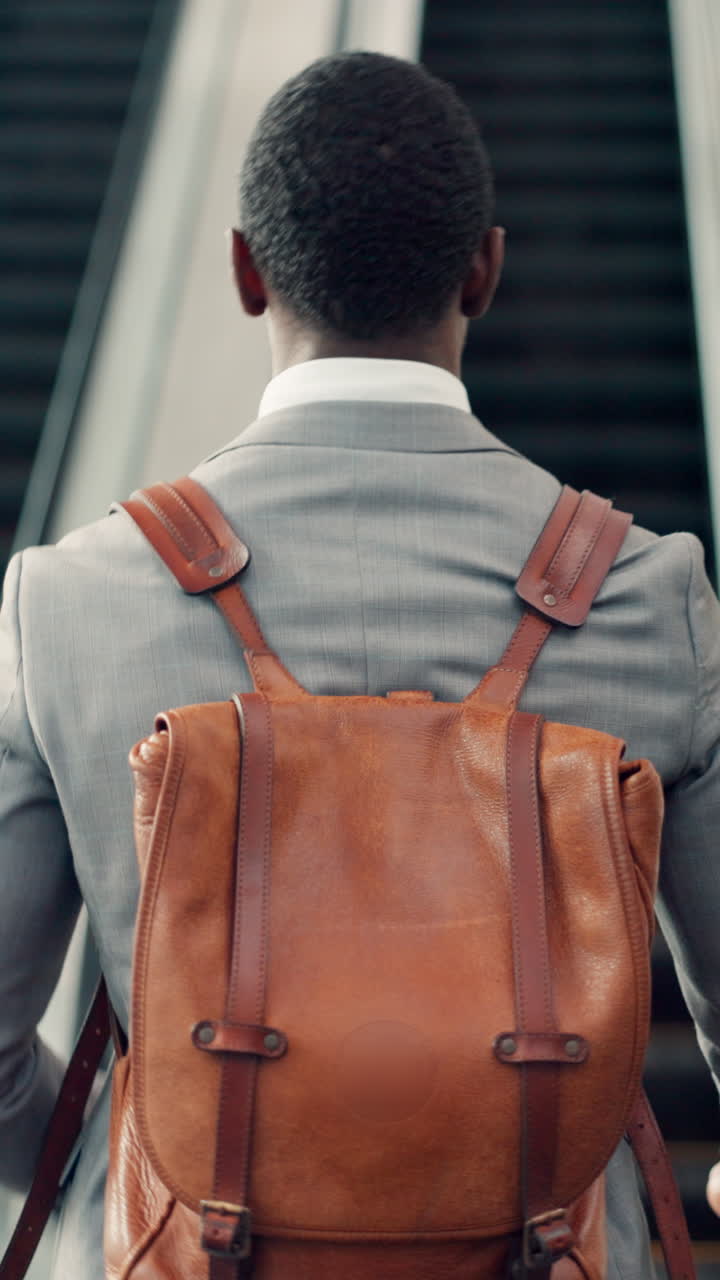 Professional Man in Suit with Leather Backpack Walking