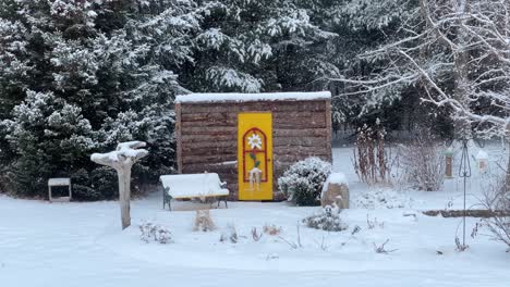 heavy snowfall creates beautiful winter wonderland with birds eating at feeders covered in fresh snow