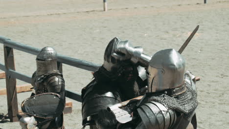 knight getting battleaxe or hatchet in face