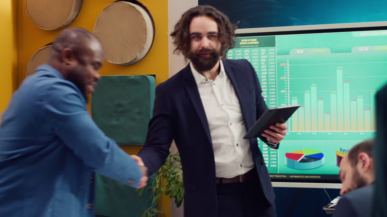 Project manager welcoming his team in business meeting