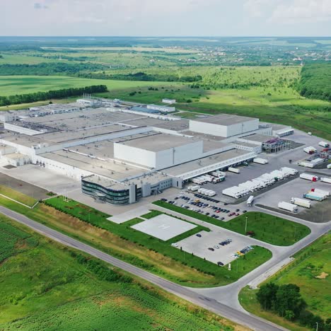 huge territory of manufacturing in nature. panoramic view of industrial plant in the middle of green fields. aerial view.