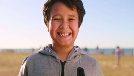 happy, smile and face of child at beach