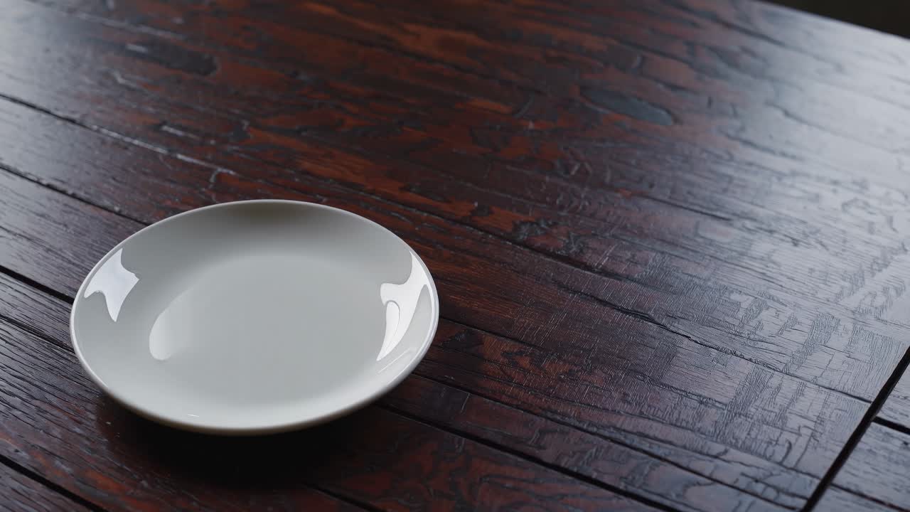 Empty White Plate on Dark Wooden Table